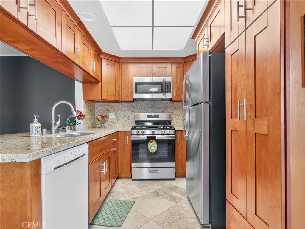 Newer granite counters, cabinets, stainless range, Refrigerator, etc. - 1159 E 1st, Tustin CA 92780 - photo 2