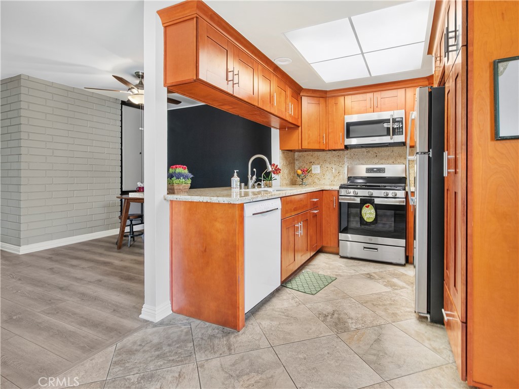 Open entrance with kitchen and dining room in view - 1159 E 1st, Tustin CA 92780 - photo 6