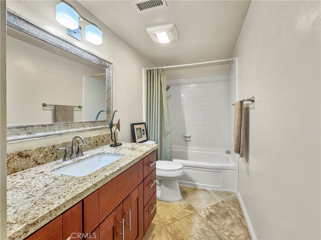 Both bathrooms remodeled with new vanities, granite counters, light fixtures and faucets. - 1159 E 1st, Tustin CA 92780 - photo 14