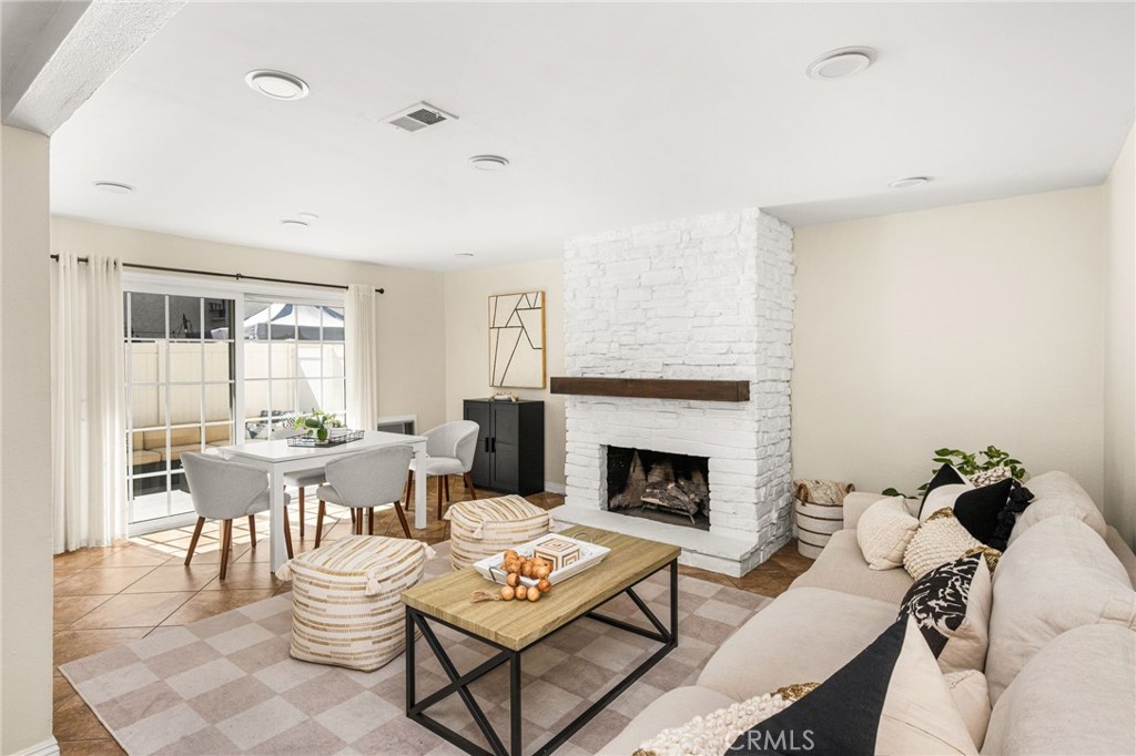 Family/Dining area with cozy fireplace - 1192 Mitchell Avenue 42, Tustin CA 92780 - photo 4