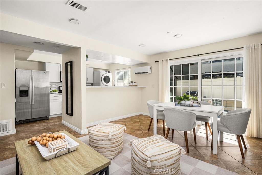 Family room with dual pane slider and AC units - 1192 Mitchell Avenue 42, Tustin CA 92780 - photo 6