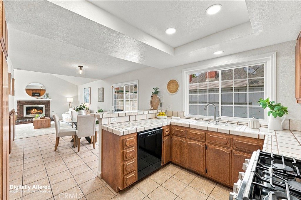 Kitchen open to great room overlooking yard - 12620 Newport Avenue, Tustin CA 92780 - photo 7