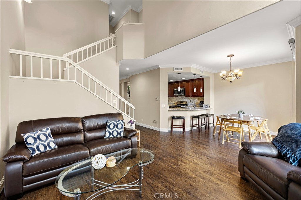 Living room with vaulted ceilings - 13462 Savanna, Tustin CA 92782 - photo 8