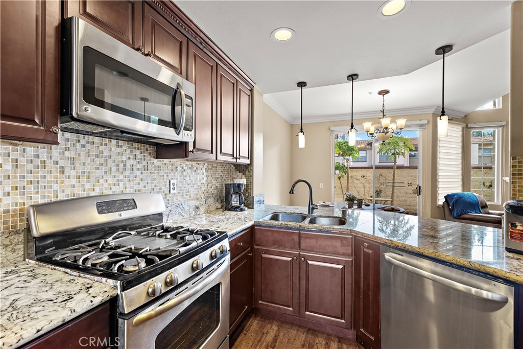 Kitchen with all the appliances included. - 13462 Savanna, Tustin CA 92782 - photo 13