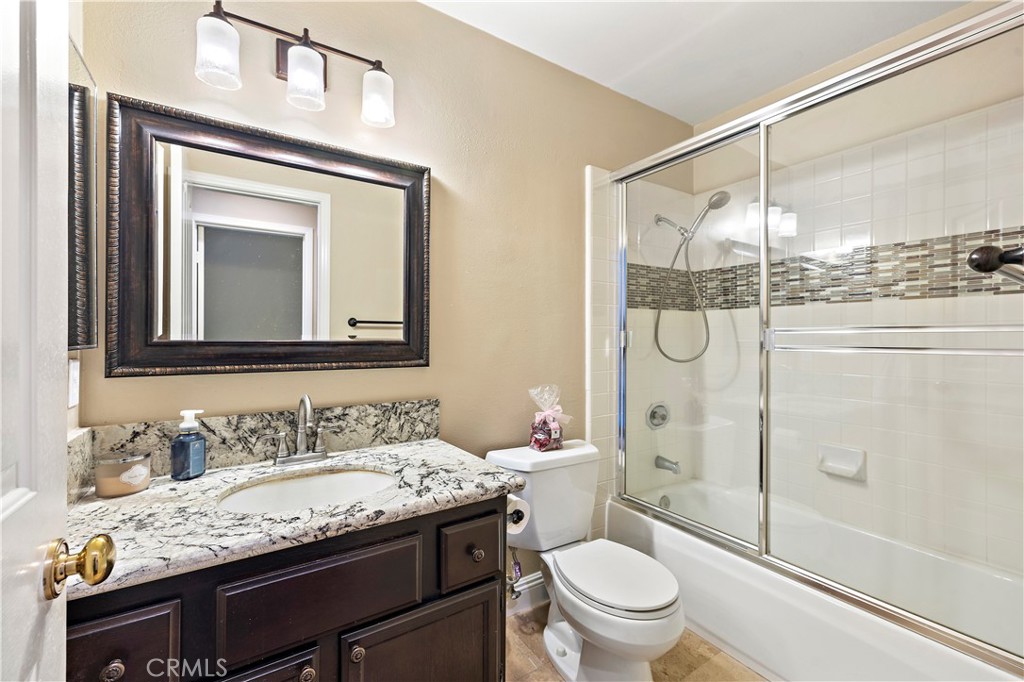 Downstairs full bathroom adjacent to bedroom - 13462 Savanna, Tustin CA 92782 - photo 15