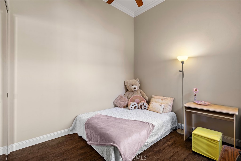 Secondary Upstairs bedroom has ceiling fan. - 13462 Savanna, Tustin CA 92782 - photo 22