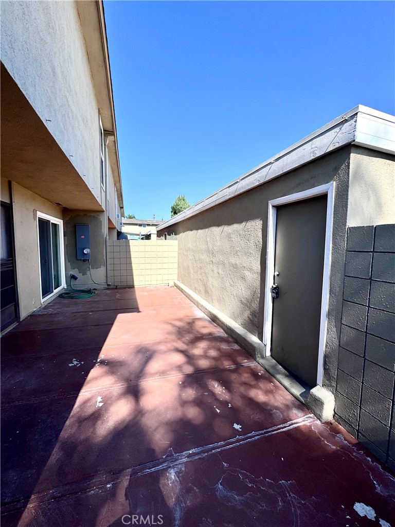 Back Patio area between garage and front door entrance - 14292 Red Hill Avenue, Tustin CA 92780 - photo 20