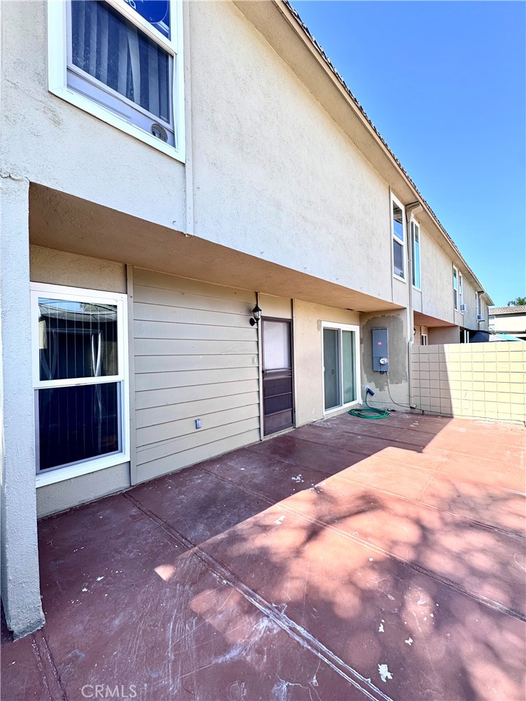 Back Patio area between garage and front door entrance - 14292 Red Hill Avenue, Tustin CA 92780 - photo 21