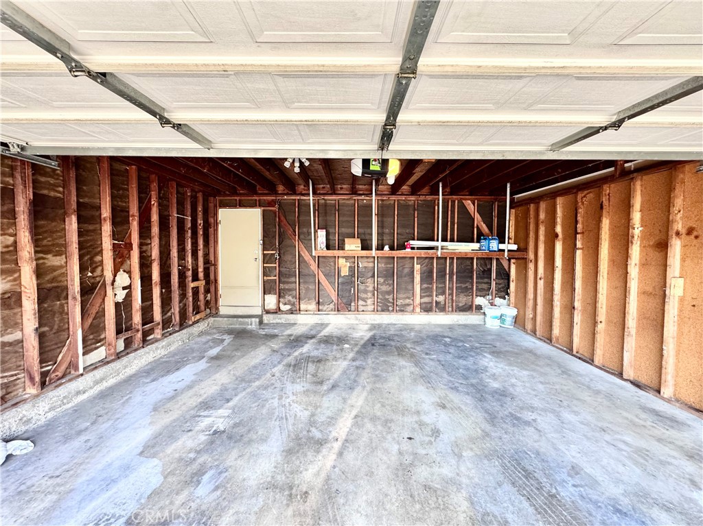 2 car garage with shelving - 14292 Red Hill Avenue, Tustin CA 92780 - photo 24