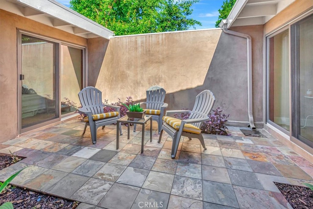 Atrium in center brings in so much natural light - 14412 GRASSMERE, Tustin CA 92780 - photo 6