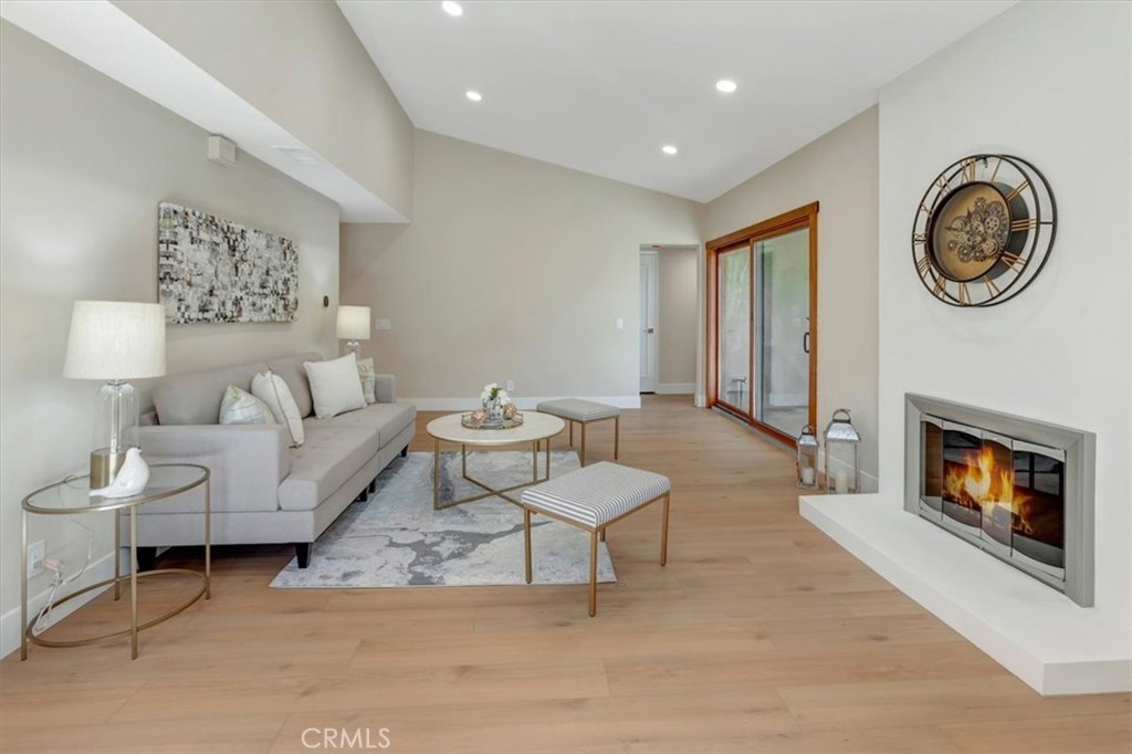 Cozy fireplace (virtual fire), recessed lighting, new flooring throughout, fresh paint, new baseboards - 14412 GRASSMERE, Tustin CA 92780 - photo 9