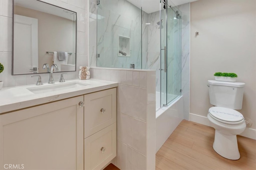 ALL NEW hall shower over tub, cabinetry, quartz countertop, tiled backsplash, recessed lighting, toilet! SKYLIGHT! - 14412 GRASSMERE, Tustin CA 92780 - photo 20
