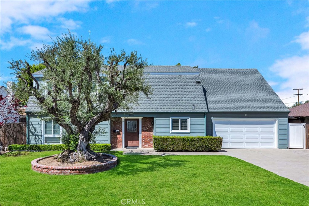 Freshly painted exterior in crisp colors + a lush green lawn = curb appeal! - 17291 Bergen Circle, Tustin CA 92780 - photo 1