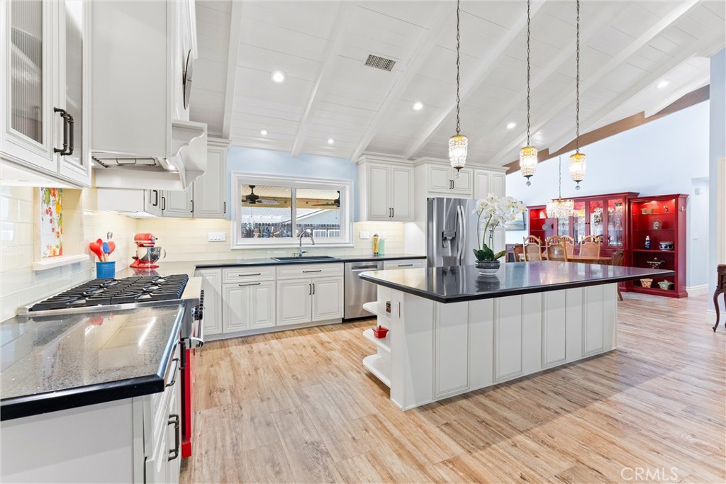 Open kitchen with a large island - 1742 Brookshire Avenue, Tustin CA 92780 - photo 1