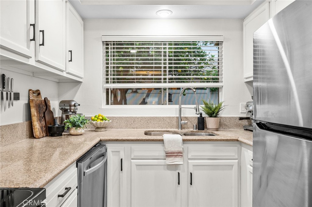 Kitchen with abundant natural light - 1881 Mitchell Avenue 135, Tustin CA 92780 - photo 10