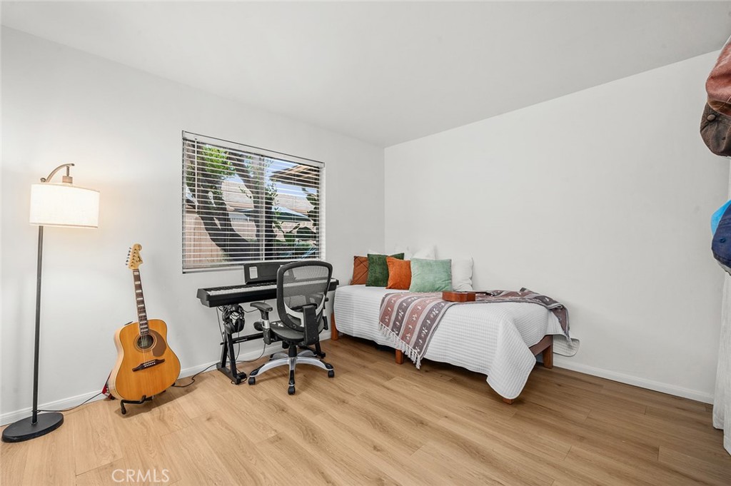 Second bedroom with new flooring and plenty of space for a home office - 1881 Mitchell Avenue 135, Tustin CA 92780 - photo 26