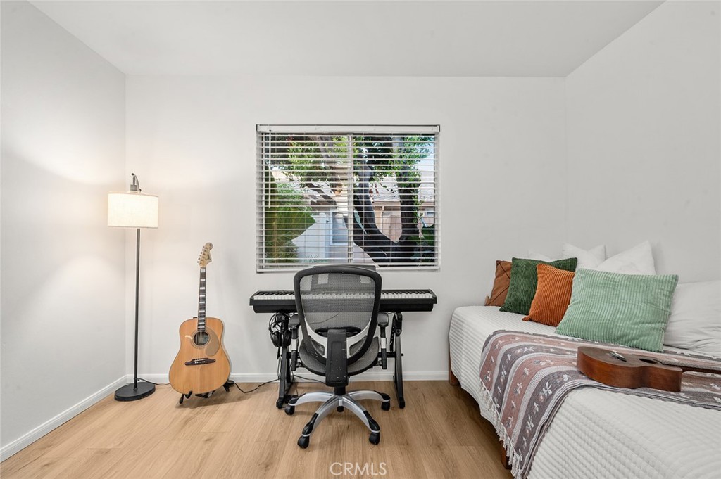 Second bedroom with new flooring and plenty of space for a home office - 1881 Mitchell Avenue 135, Tustin CA 92780 - photo 27