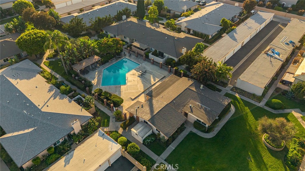 Aerial view of the community showing the pool, greenbelts and surrounding neighborhood - 1881 Mitchell Avenue 135, Tustin CA 92780 - photo 37