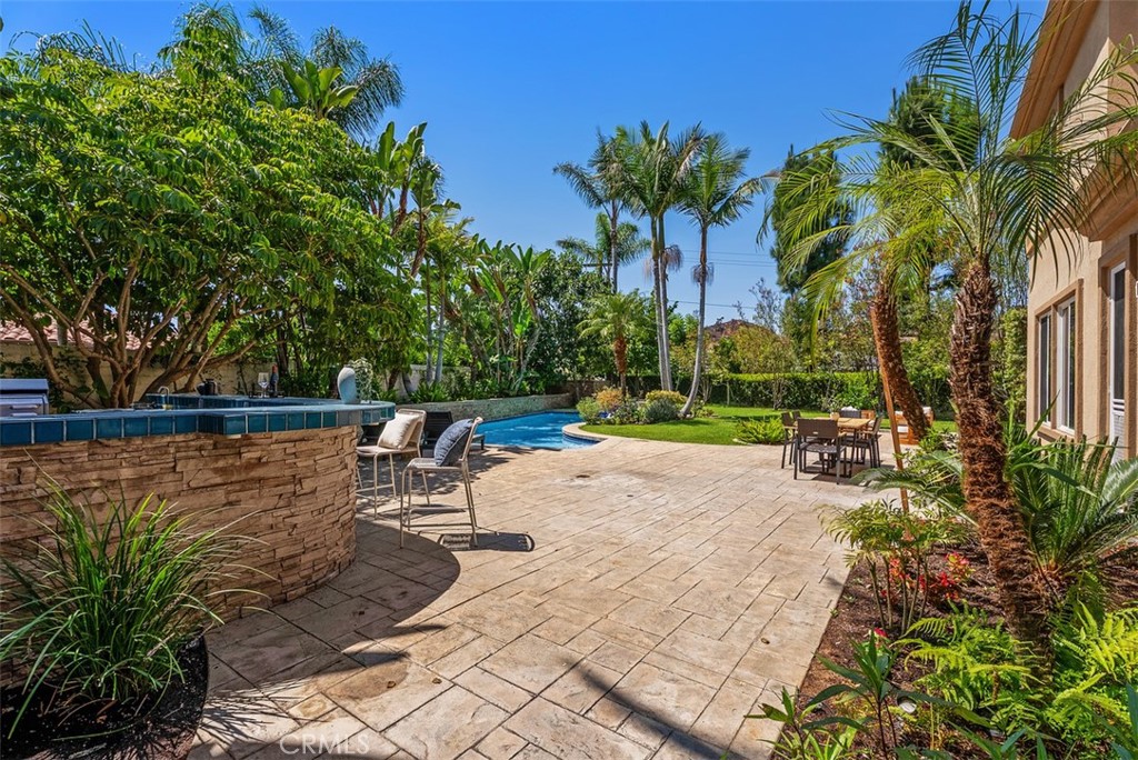 Buil in BBQ and burner with bar and entertainment center - 2150 Chandler Drive, Tustin CA 92782 - photo 38
