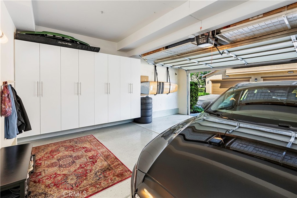 Two vehicle garage with built-in storage. - 3216 Carrotwood, Tustin CA 92782 - photo 19