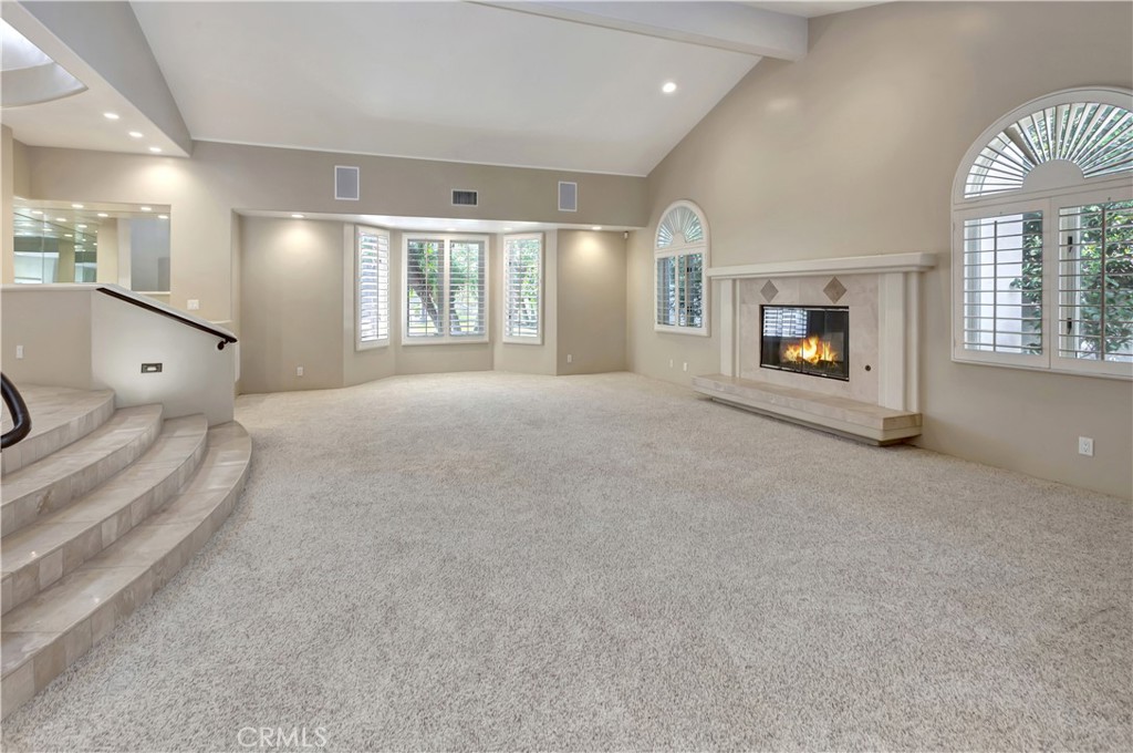Living room with AI-gen'd flames - 10762 Center Drive, Villa Park CA 92861 - photo 3