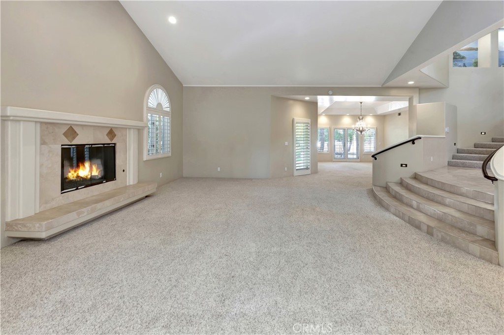 Living room with AI-gen'd flames - 10762 Center Drive, Villa Park CA 92861 - photo 4