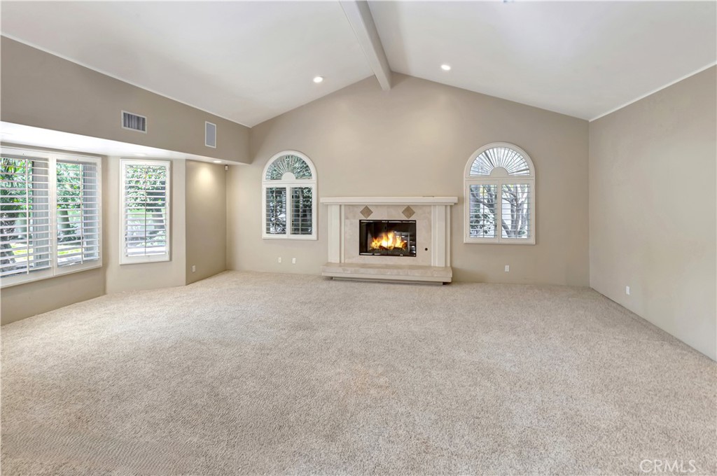Living room with AI-gen'd flames - 10762 Center Drive, Villa Park CA 92861 - photo 5