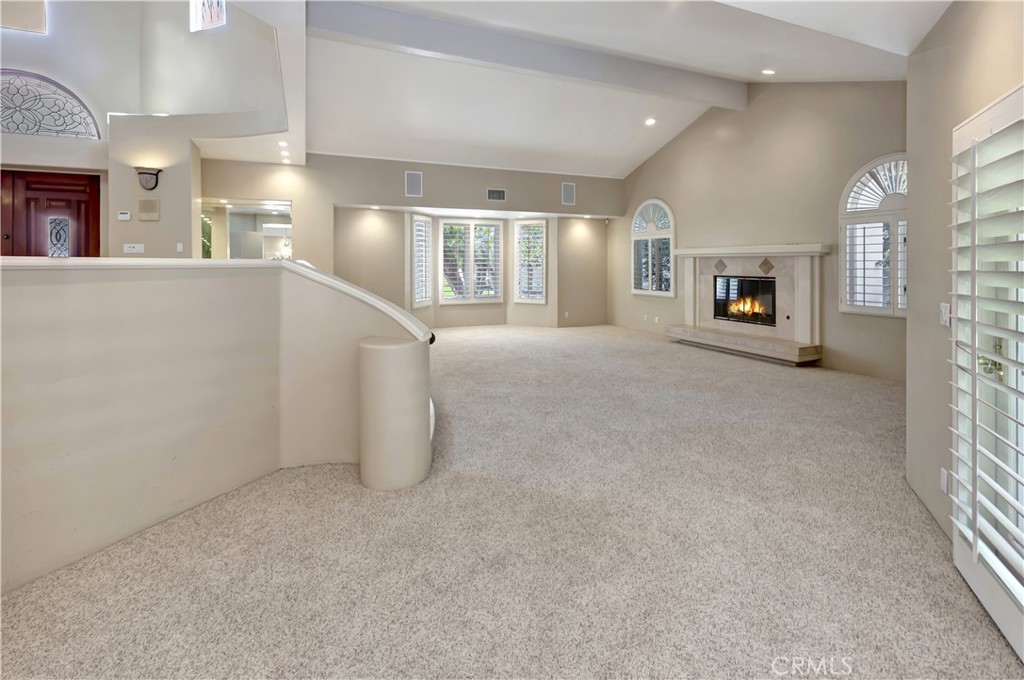 Living room with AI-gen'd flames - 10762 Center Drive, Villa Park CA 92861 - photo 8