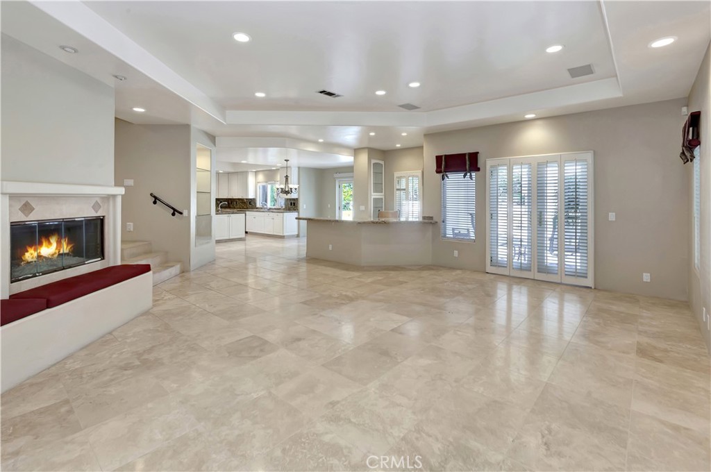 Family Room off the kitchen - with AI-flames - 10762 Center Drive, Villa Park CA 92861 - photo 17