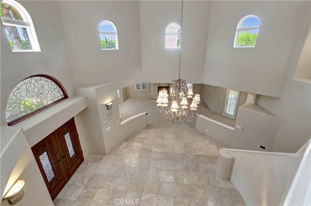 Top o' the stairs overlooking entry hall - 10762 Center Drive, Villa Park CA 92861 - photo 19