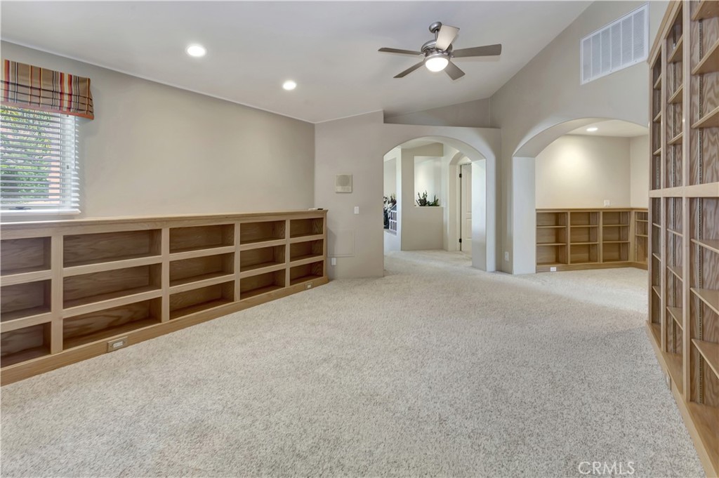 Loft area for study or game room - carpet wrinkles AI-removed - 10762 Center Drive, Villa Park CA 92861 - photo 32