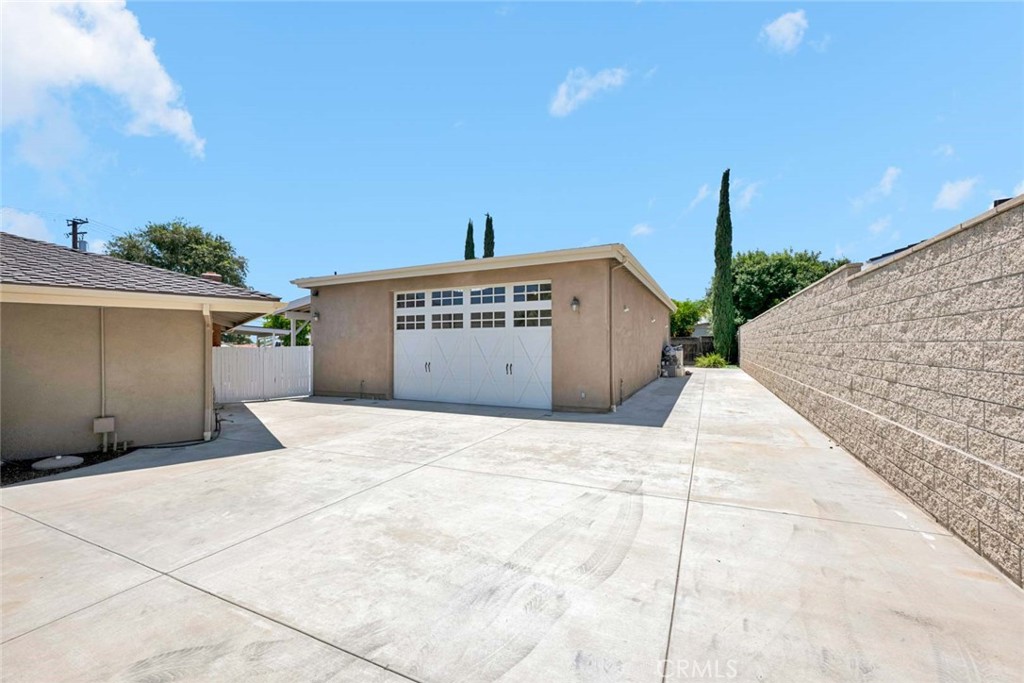 Separate gate and driveway for 1500 sq. ft. extra high garage. - 18381 Serrano, Villa Park CA 92861 - photo 4