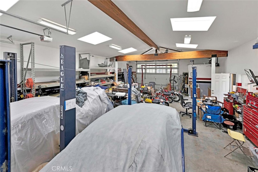 Interior of garage showing lift. - 18381 Serrano, Villa Park CA 92861 - photo 10
