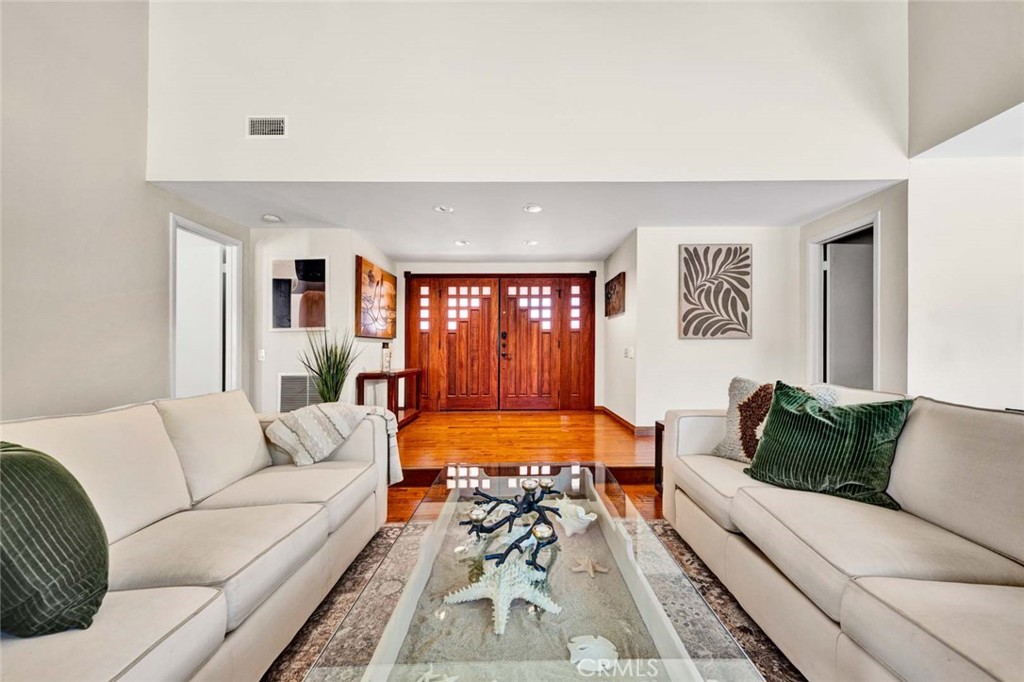 Custom double entry wood doors and side lights. Wood floor entry. - 18381 Serrano, Villa Park CA 92861 - photo 13