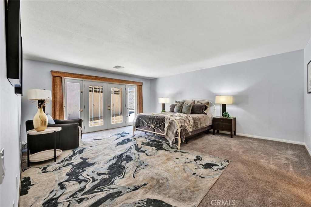 Primary suite shows large spacious room and French doors to outside. - 18381 Serrano, Villa Park CA 92861 - photo 17