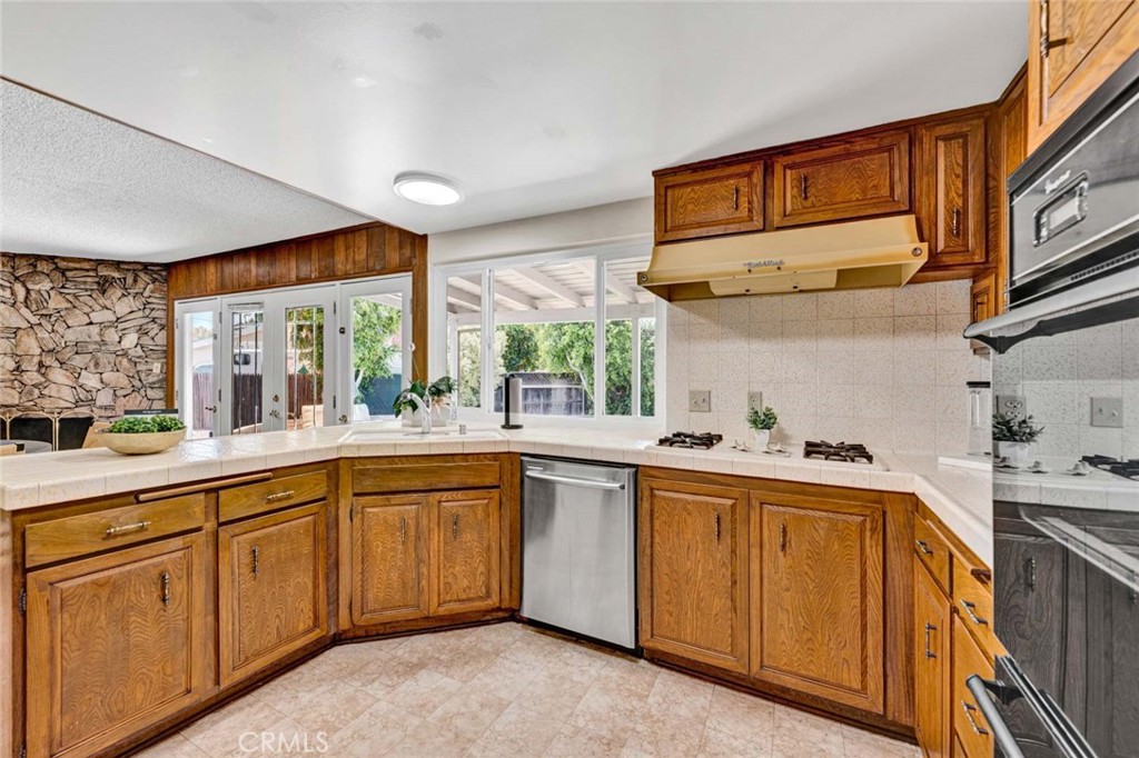 Kitchen with corner sink and picture window. - 18381 Serrano, Villa Park CA 92861 - photo 24