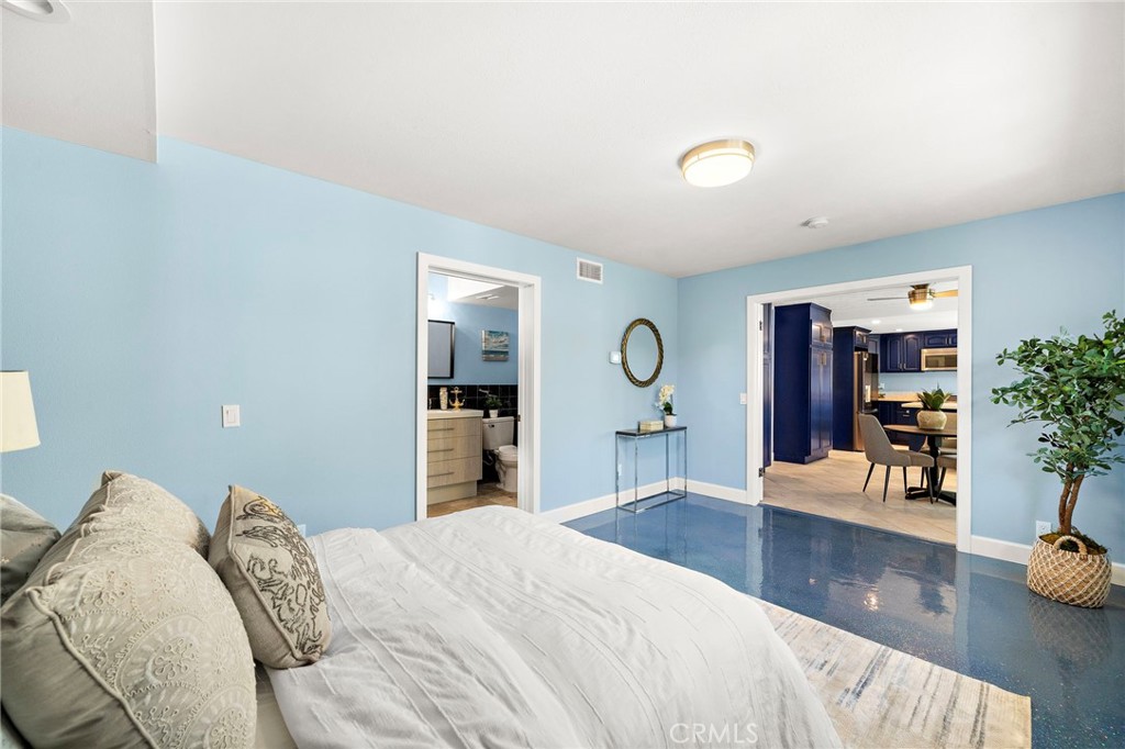 downstairs primary suite features French doors opening to the living area - 16102 Nelson Street, Westminster CA 92683 - photo 17