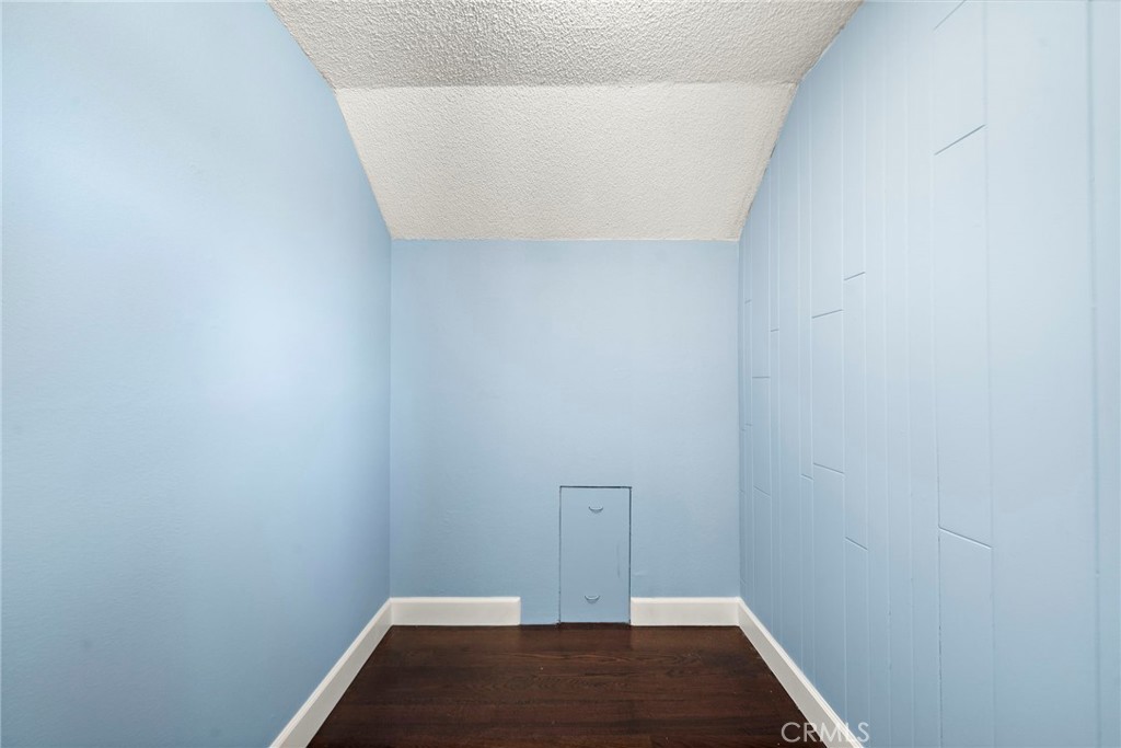 walk in closet with additional attic space - 16102 Nelson Street, Westminster CA 92683 - photo 27