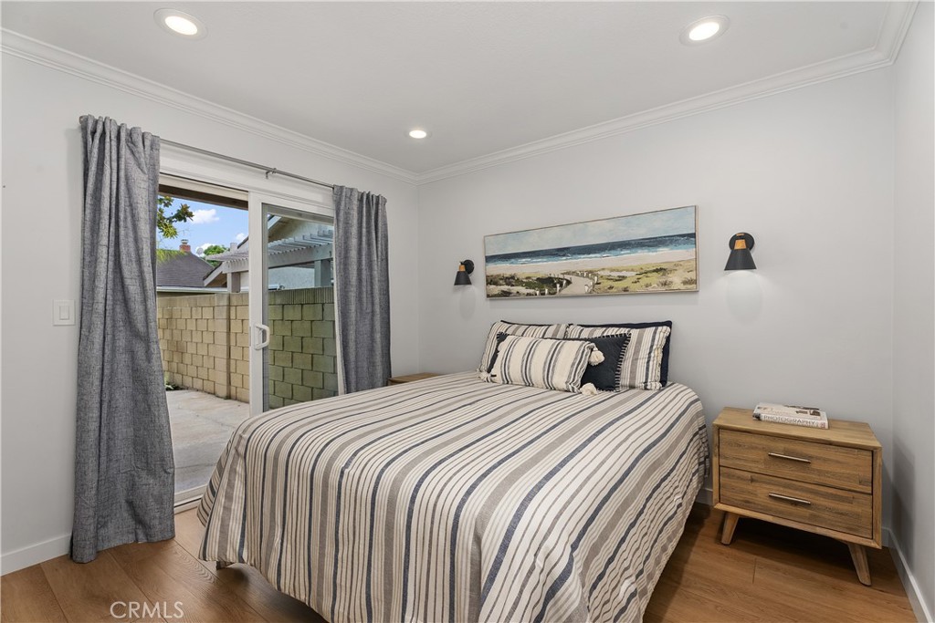 First floor bedroom, sliding door to the side patio. - 5112 Kingscross, Westminster CA 92683 - photo 17