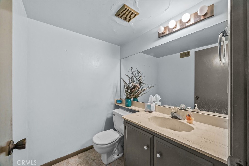 Downstairs half bathroom - 8441 Tulipwood Circle, Westminster CA 92683 - photo 19