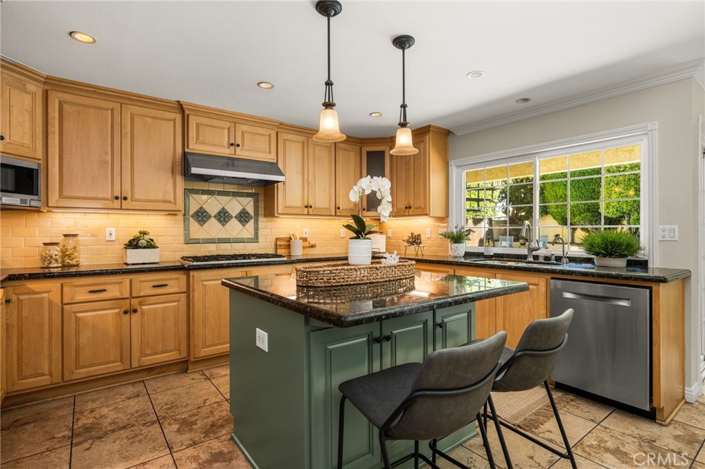 Kitchen with center island and backyard-facing window. - 8981 Blackheath Circle, Westminster CA 92683 - photo 3
