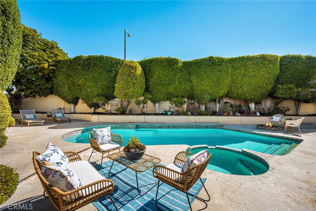 Pool and spa with outdoor seating areas. - 8981 Blackheath Circle, Westminster CA 92683 - photo 4