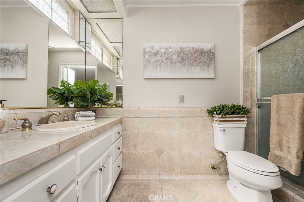 Primary bathroom with vanity and enclosed shower. - 8981 Blackheath Circle, Westminster CA 92683 - photo 14