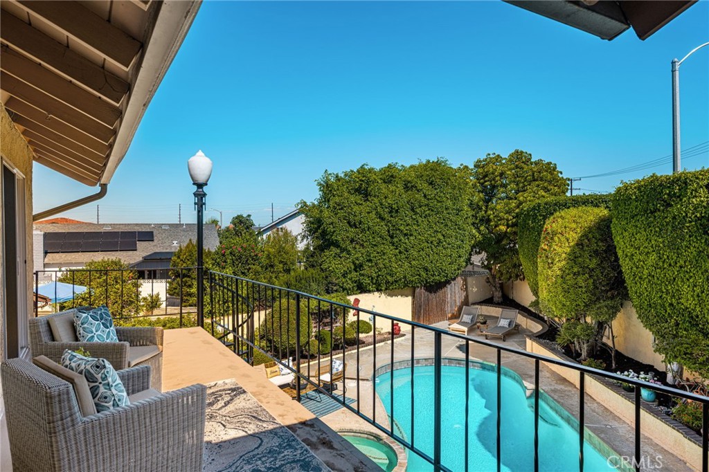 Covered upstairs balcony overlooking the pool. - 8981 Blackheath Circle, Westminster CA 92683 - photo 18