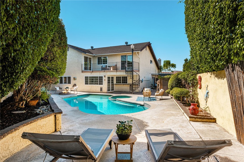 Pool and backyard looking toward the home and balcony. - 8981 Blackheath Circle, Westminster CA 92683 - photo 22