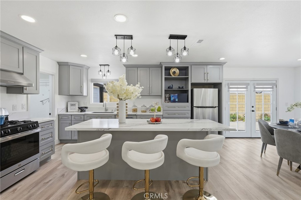 Remodeled Kitchen with Big Quartz Island and Quartz Counter Top - 9051 Glenridge Avenue, Westminster CA 92683 - photo 1