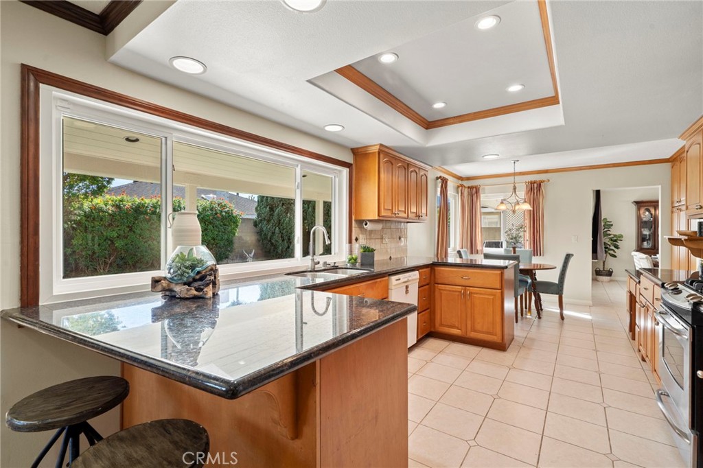 Gorgeous chef's kitchen with granite countertops and views to the backyard - 9552 Westwood Drive, Westminster CA 92683 - photo 21