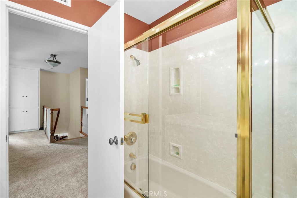 The home features dual-pane windows, smooth ceilings, crown molding, recessed lighting, a blend of tile and wood laminat - 9552 Westwood Drive, Westminster CA 92683 - photo 28