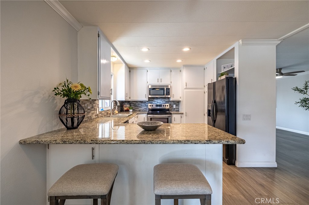 Open Kitchen with Breakfast Bar and storage cabinet - 16757 Lake Terrace Way, Yorba Linda CA 92886 - photo 19