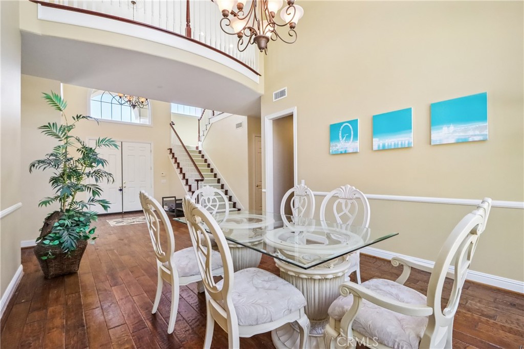 Dining area and view of front door, 2nd floor catwalk, stairs - 17218 Blue Spruce, Yorba Linda CA 92886 - photo 11